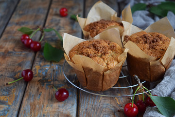 Muffin from flax seeds, millet and rice flour with cherries. Homemade baking. Organic healthy vegetarian food. Gluten free. Dairy free. Grain free pastries. Rustic photo. Copy space