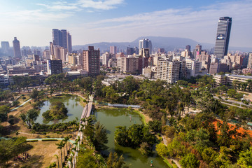 Fototapeta na wymiar City Park surrounded by high rises 
