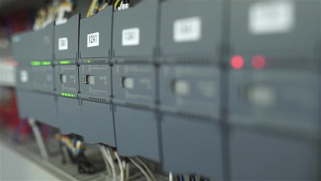 The electrician switches on the circuit breakers and starts the system