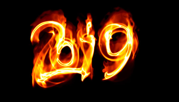 Happy new year 2019 isolated numbers lettering written with white fire flame or smoke on black background