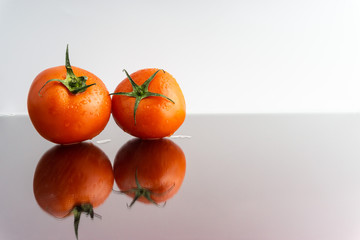 Red tomatoes with selective focus and crop fragment