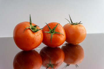 Red tomatoes with selective focus and crop fragment
