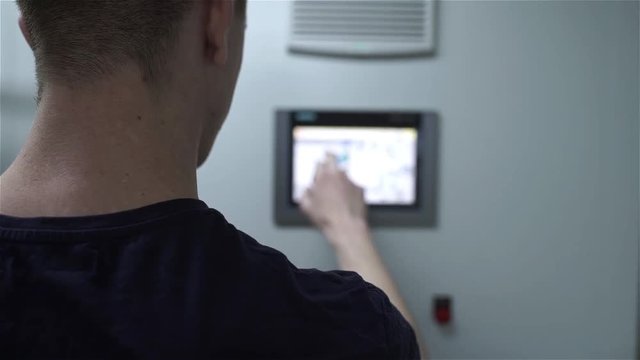 the service engineer changes and presses on the touch panel