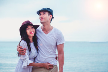 Happy sea lifestyle,Young family, man and woman rest on the beach of ocean.