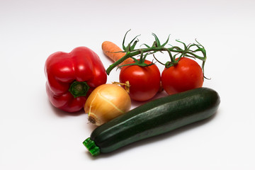 Morov, onion, zucchini, tomato, red bell pepper, on white background.