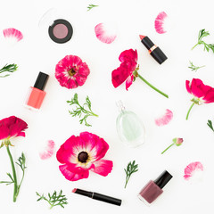 Obraz na płótnie Canvas Floral composition with flowers, petals and feminine cosmetics on white background. Flat lay, top view. Beauty background