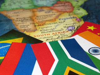 Flags of the BRICS countries on the South Africa map. Concept for summit of Brazil, Russia, India, China and South Africa in Johannesburg
