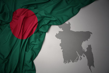 waving colorful national flag and map of bangladesh.