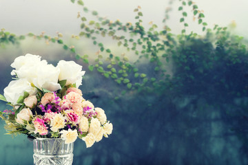 flower in glass vase on white table