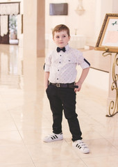 Beautiful little boy in a butterfly