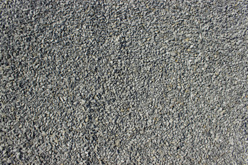 Building crushed stone. Small road rubble. Texture