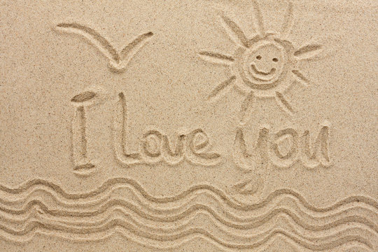 I love you handwritten in sand for natural, love,tourism or conceptual designs.