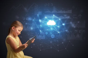 Adorable girl working on tablet with cloud technology concept

