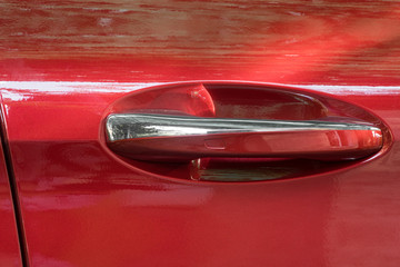 red door of a luxury car