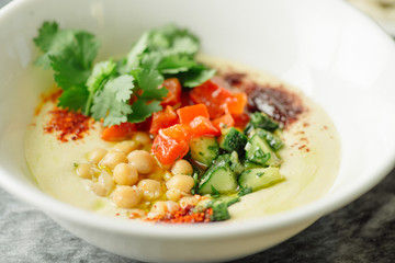 Hummus with vegetables, herbs, spices and cakes