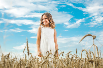 Happy child. Worth in the middle of the field