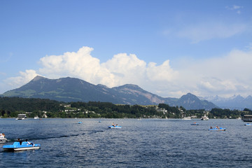 Fototapeta na wymiar Boats sailing on Lake in Lucerne, Switzerland.
