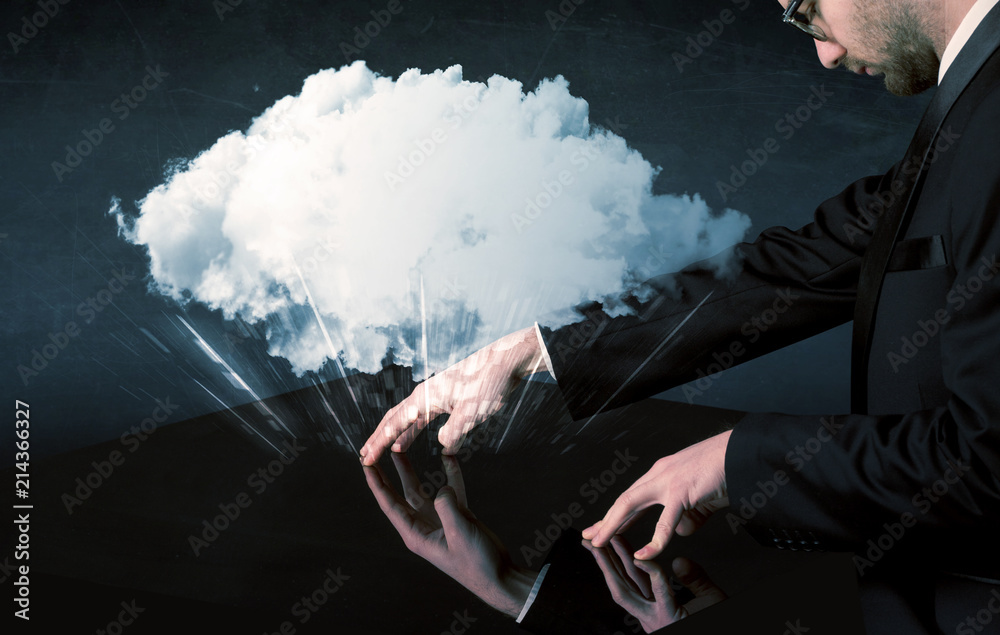 Poster male hands touching interactive table with a white cloud on it