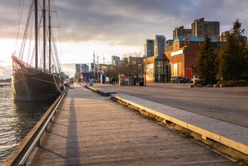Foto op Plexiglas Boardwalk on Toronto Waterfront Lit by an Autumnal Setting Sun. ON, Canada.  © alpegor