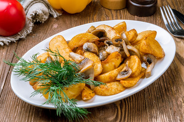 Fried potatoes with mushrooms