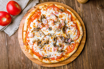 Pizza with ham and mushrooms