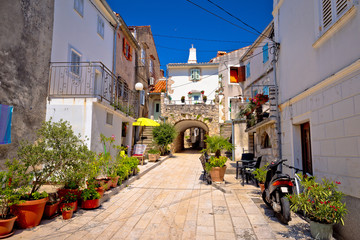 Fototapeta na wymiar Town of Omisalj old mediterranean street view
