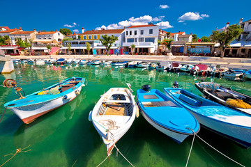 Town of Njivice turquoise harbor and waterfront view