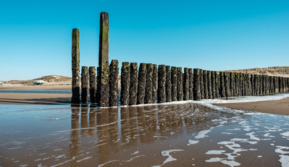 Beach poles on the beach of Domburg, the Netherlands.
