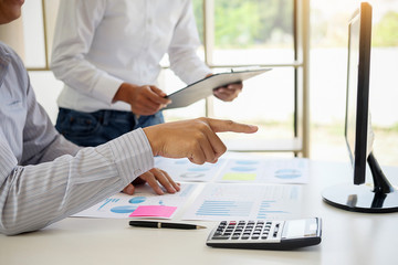 Business adviser analyzing financial figures denoting the progress Internal Revenue Service checking document. Audit concept