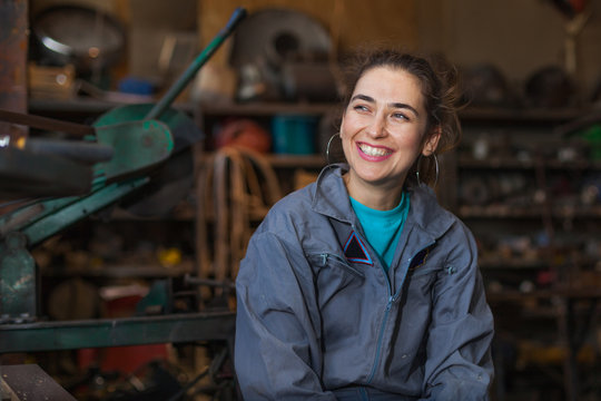 young woman mechanic in a workshop