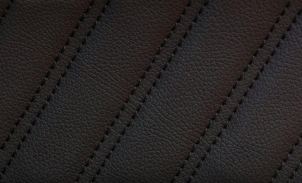 closeup shot of black leather car seat with  stitch,sports luxury car
