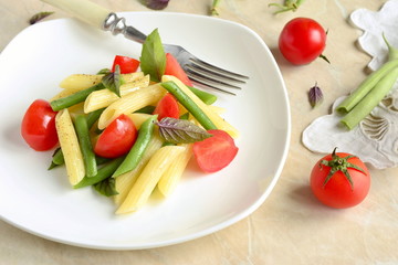 Penne pasta with green beans, cherry tomatoes and basil