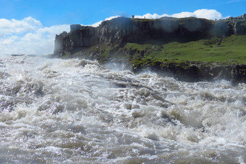 Wild water splashing, even on camera lens, at Dettifoss waterfall, Iceland