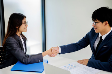 Successful businessmen handshaking after good deal. Business handshake and business people.