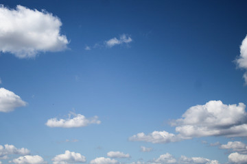 Blue sky with white clouds, background, clear day