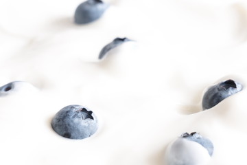 Yogurt and fresh berries blueberries, background. Flat lay, top view, copy space 
