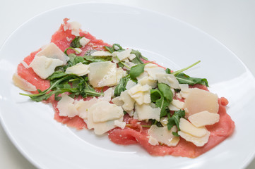 Beef carpaccio with parmesan, rocket and balsamic vinegar