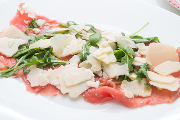 Beef carpaccio with parmesan, rocket and balsamic vinegar