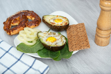 Eggs baked in avocado on plate