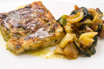 fried fish in the plate with vegetable