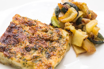 fried fish in the plate with vegetable