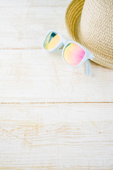 Summer holidays vacation concept background, hat, sunglasses, white wooden background copy space