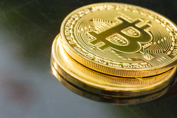 cryptocurrency golden coins - Bitcoin, Ethereum with black background. Virtual money concept.