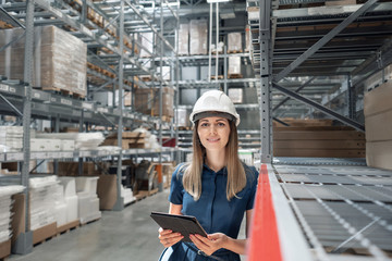 Beautiful young woman worker of furniture store in shopping center. Girl looking for goods with a...