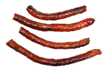 Fried sausages isolated on white background, top view
