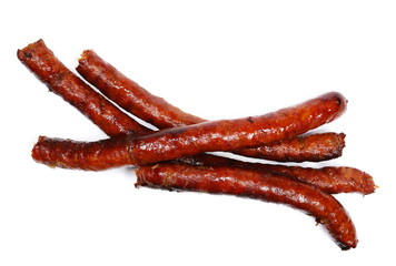Fried sausages isolated on white background, top view