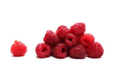 pile raspberries isolated on white