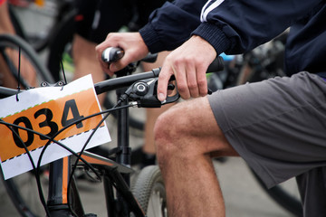 Active lifestyle: The athlete sits on the bike No. 034 before the start of the bicycle race