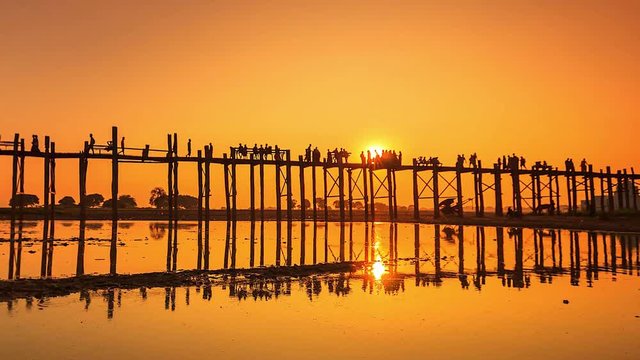 4K Time lapse of U Bein Bridge that is a wooden bridge across Ayeyarwady river in Amarapura where is apart of Mandalay, Myanmar.