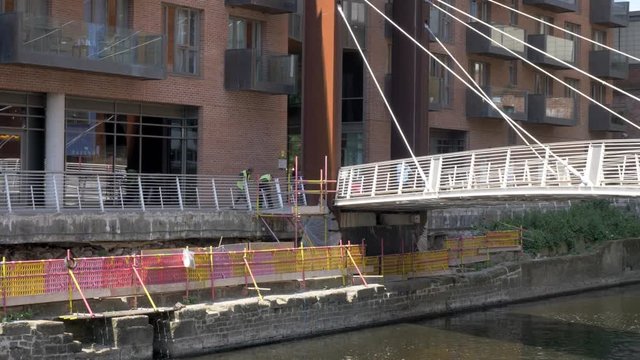 Workers repairing riverside Leeds